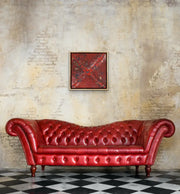 Planet B - Heart Art Original  - on clay colored brick wall in living room with red leather settee