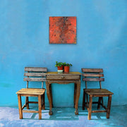 In The Beginning There Was Hot Magma Mixed Media Painting Original Heart Art Painting - on sky blue wall - with small wooden table and two terrace chairs 