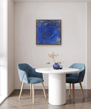 Neoliberal Earth exploitation - Heart Art Original - on light grey wall in dining space with white dining table