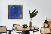 Neoliberal Earth exploitation - Heart Art Original - on light grey wall in living space with dark wooden dining table