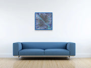 Framed Milky Way Galaxy In room with parquet floor, blue couch and hanging on white wall