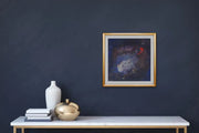 The Earth’s Origins - a Big Bang  - on dark blue grey wall with small shelf