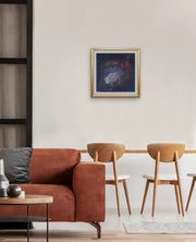 The Earth’s Origins - a Big Bang  - on light olive wall in living area with peach colored settee and two wooden bar stools