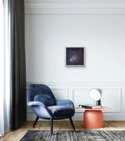 The Earth’s Origins - a Big Bang  - on light blue white wall with blue reading armchair