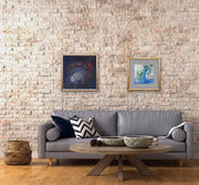 Open Your Eyes - Heart Art Original - on brick wall - in living area with grey couch